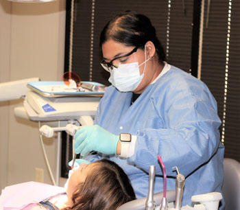 Young girl having dental work done
